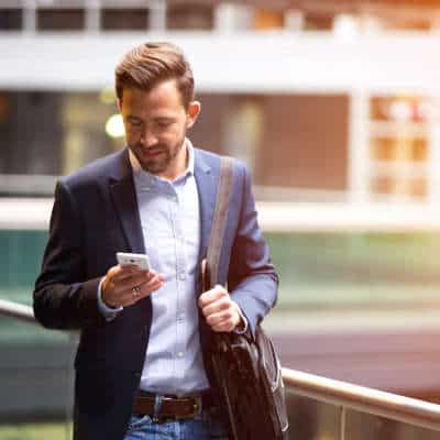 Businessman looking at smartphone