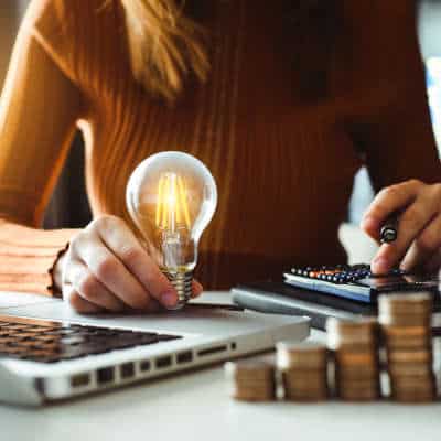 Woman holding a lightbulb